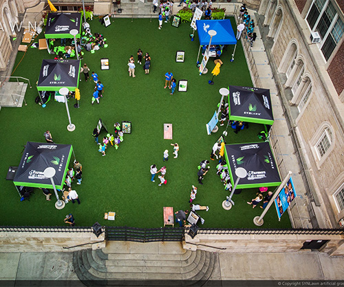 Farmers on the green artificial grass community area