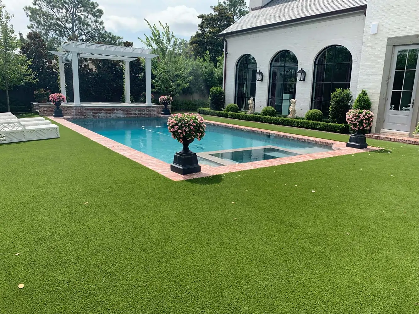 Backyard artificial grass pool area installed by SYNLawn